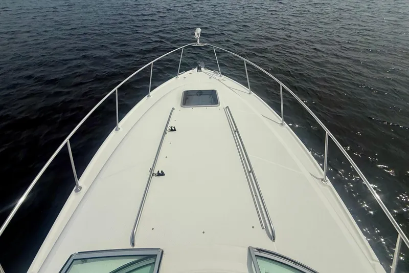 Slide: The Image of Bow view of 2006 Chaparral Signature 290 boat on calm water. - 13
