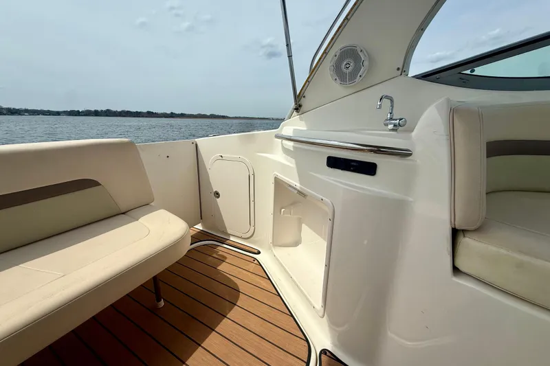 Slide: The Image of 2006 Chaparral Signature 290 boat interior with seating and water view. - 23
