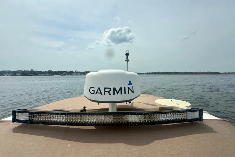 Slide: The Image of 2006 Chaparral Signature 290 boat with Garmin radar on calm water. - 26