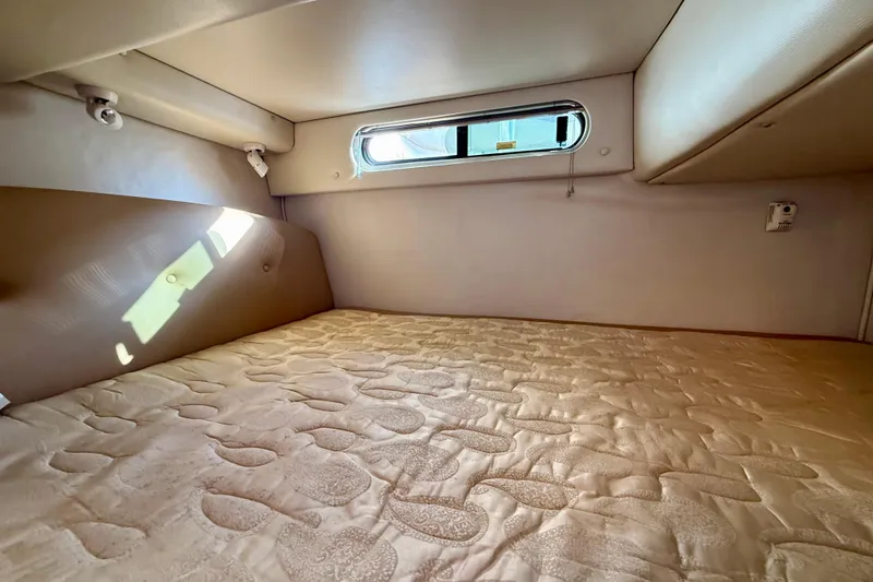 Slide: The Image of Interior cabin of 2006 Chaparral Signature 290 boat with cozy sleeping area. - 30