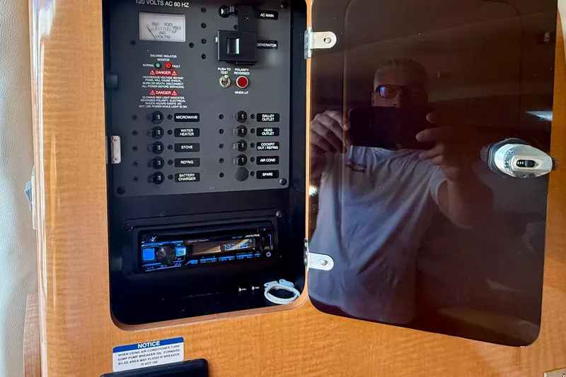 Slide: The Image of Electrical panel inside 2006 Chaparral Signature 290 boat, featuring various control switches. - 31