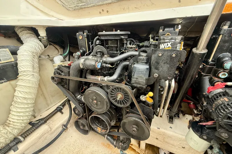 Slide: The Image of Engine compartment of a 2006 Chaparral Signature 290 boat, showcasing mechanical components. - 32