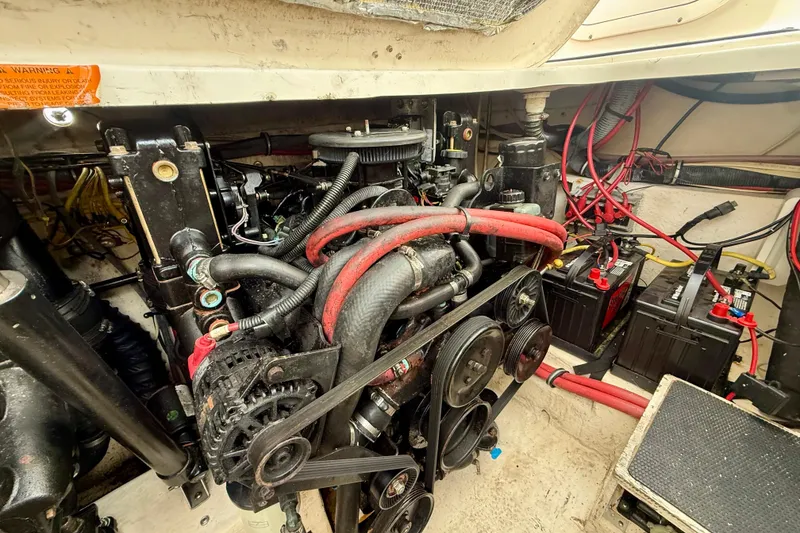 Slide: The Image of Engine compartment of a 2006 Chaparral Signature 290 boat, showing belts and batteries. - 33