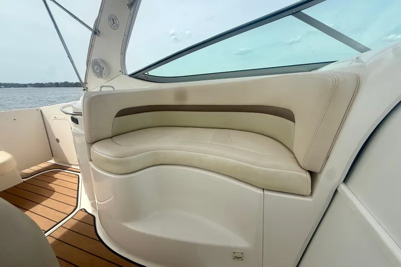 Slide: The Image of 2006 Chaparral Signature 290 boat interior with beige seating and wooden flooring. - 7