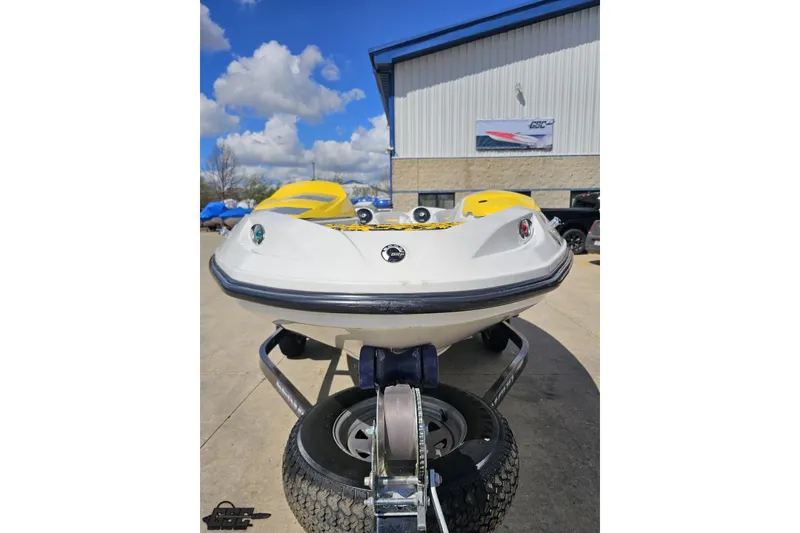 Slide: The Image of 2007 Sea-Doo Sport Boats 150 Speedster on trailer, parked outdoors under blue sky. - 14