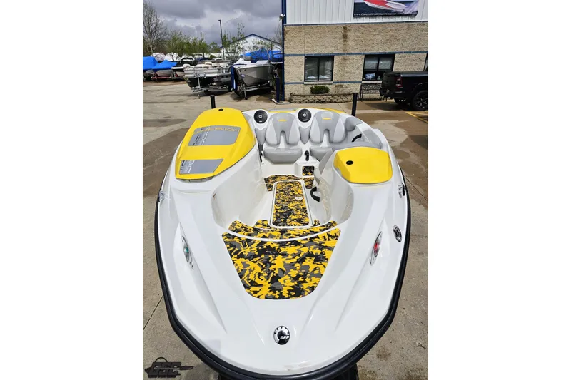 Slide: The Image of 2007 Sea-Doo 150 Speedster boat with yellow accents, parked outdoors. - 16
