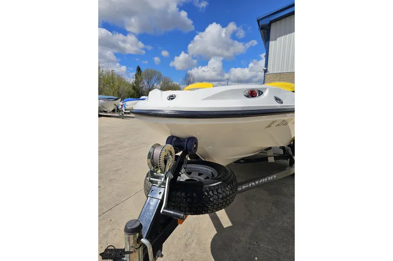 Slide: The Image of 2007 Sea-Doo 150 Speedster boat on trailer under blue sky. - 19