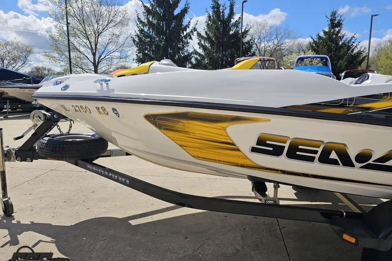 Slide: The Image of 2007 Sea-Doo Sport Boats 150 Speedster on trailer, parked outdoors under a clear sky. - 25