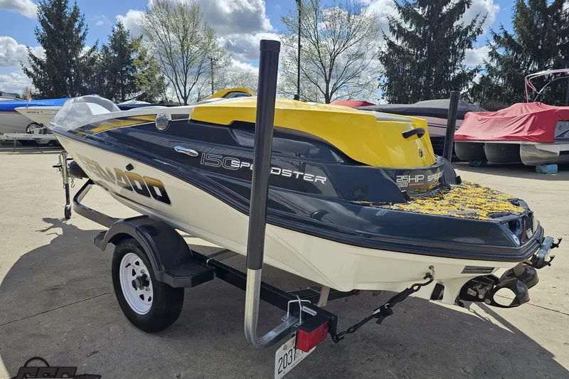 Slide: The Image of 2007 Sea-Doo 150 Speedster boat on trailer, parked outdoors under cloudy sky. - 27