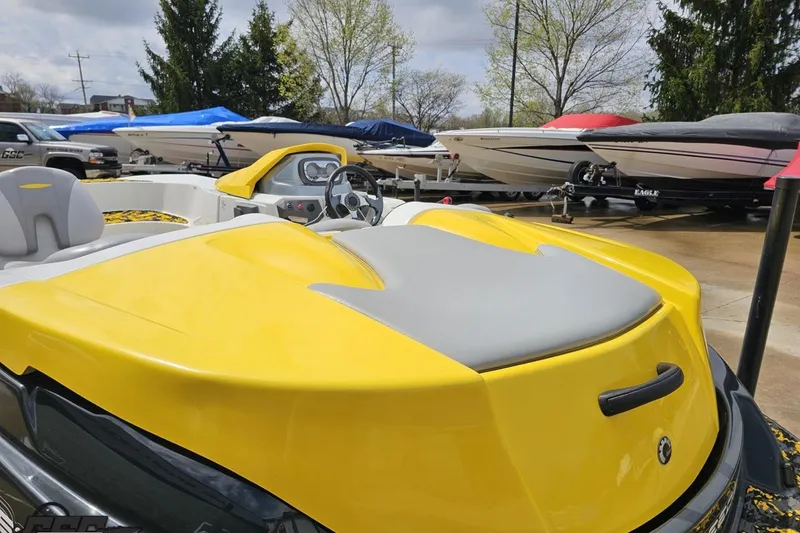 Slide: The Image of 2007 Sea-Doo Sport Boats 150 Speedster in vibrant yellow, parked among other boats. - 29