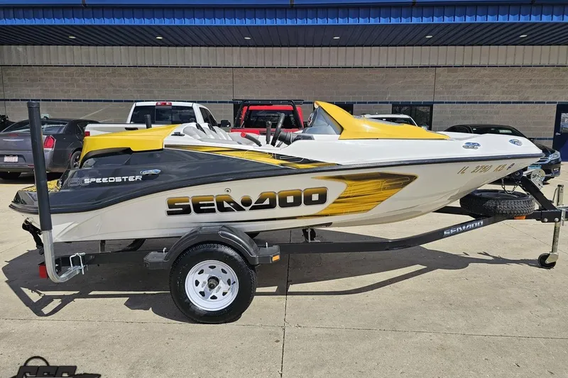 Slide: The Image of 2007 Sea-Doo 150 Speedster boat on trailer, featuring sleek yellow and white design. - 3