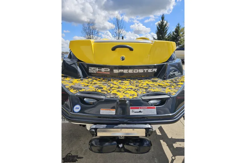 Slide: The Image of 2007 Sea-Doo 150 Speedster rear view, featuring yellow accents and 215 HP Rotax engine. - 31