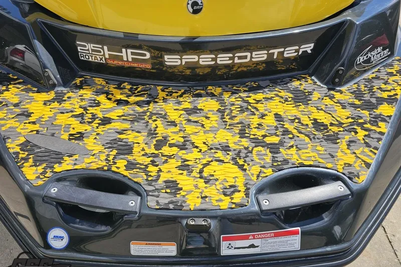 Slide: The Image of 2007 Sea-Doo 150 Speedster rear deck with yellow camo pattern and 215HP Rotax engine label. - 33