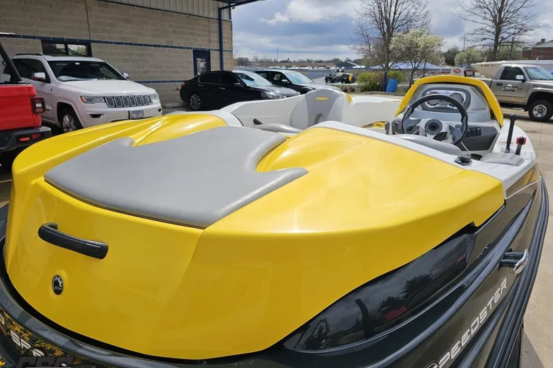 Slide: The Image of 2007 Sea-Doo 150 Speedster boat, yellow and gray, parked outdoors. - 37