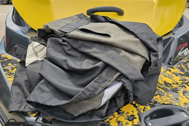 Slide: The Image of Folded cover on a 2007 Sea-Doo 150 Speedster boat, featuring a yellow and black design. - 39