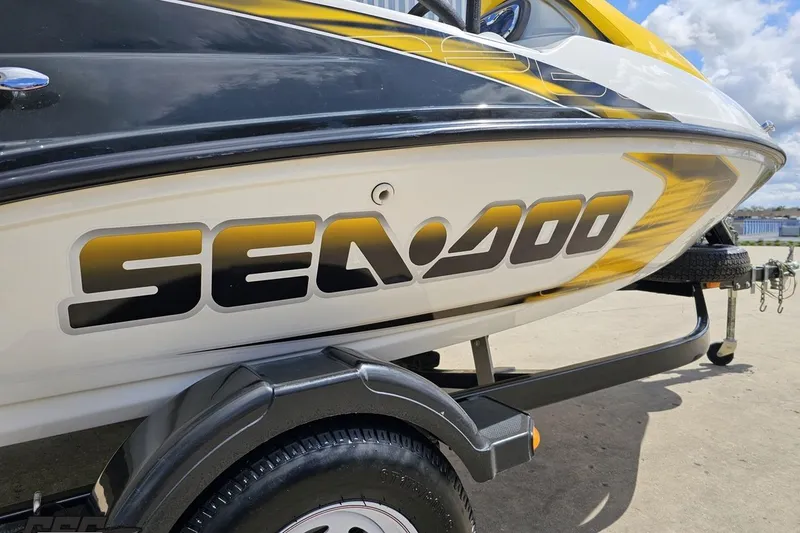 Slide: The Image of 2007 Sea-Doo 150 Speedster boat on trailer, featuring bold logo and sleek design. - 4