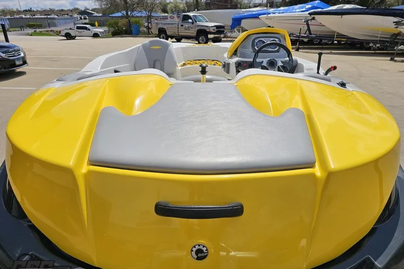 Slide: The Image of 2007 Sea-Doo 150 Speedster boat, yellow and gray, parked outdoors. - 40