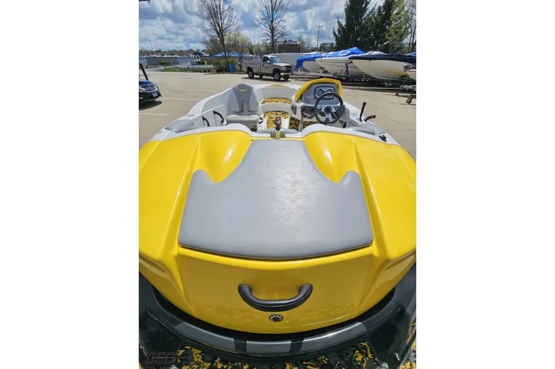 Slide: The Image of 2007 Sea-Doo 150 Speedster boat, yellow and gray, parked outdoors. - 41