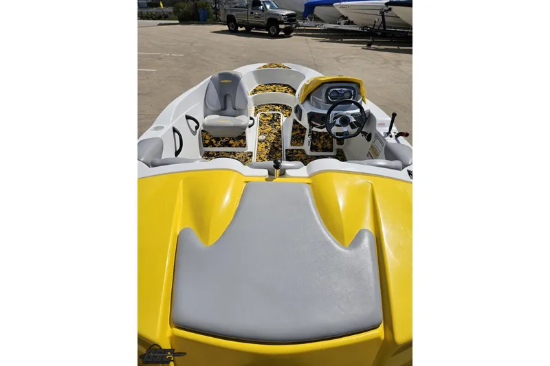 Slide: The Image of 2007 Sea-Doo 150 Speedster boat interior with yellow and gray seating. - 42