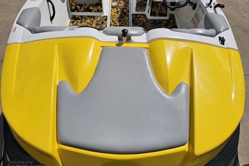 Slide: The Image of 2007 Sea-Doo 150 Speedster, yellow and gray interior, top view of seating and controls. - 43