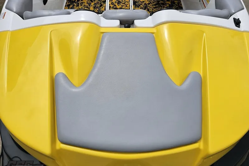 Slide: The Image of 2007 Sea-Doo 150 Speedster boat with yellow and gray seating area. - 44