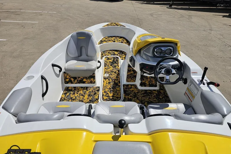 Slide: The Image of 2007 Sea-Doo 150 Speedster interior with yellow accents and patterned flooring. - 46