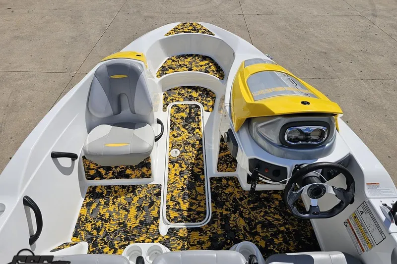 Slide: The Image of 2007 Sea-Doo 150 Speedster boat interior with yellow accents and patterned flooring. - 49