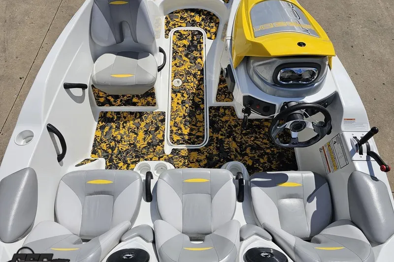Slide: The Image of 2007 Sea-Doo 150 Speedster interior with gray seats and vibrant patterned flooring. - 50