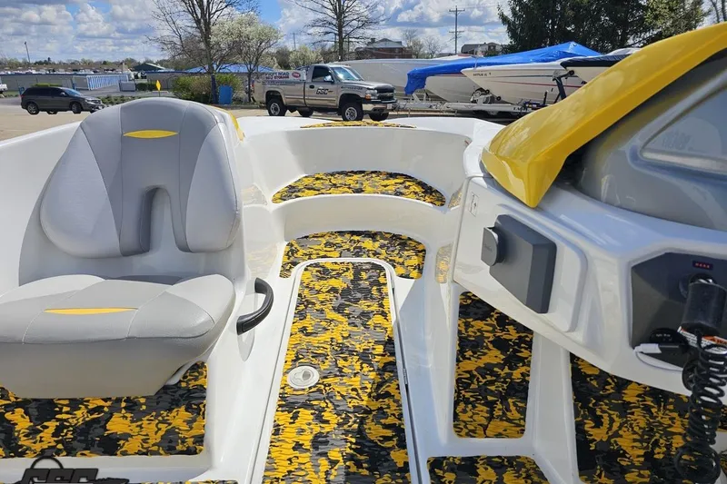 Slide: The Image of 2007 Sea-Doo 150 Speedster interior with yellow accents and gray seating. - 54