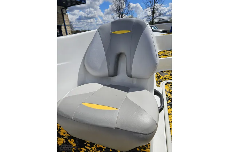 Slide: The Image of Gray and yellow seat on a 2007 Sea-Doo 150 Speedster boat, under a cloudy sky. - 55