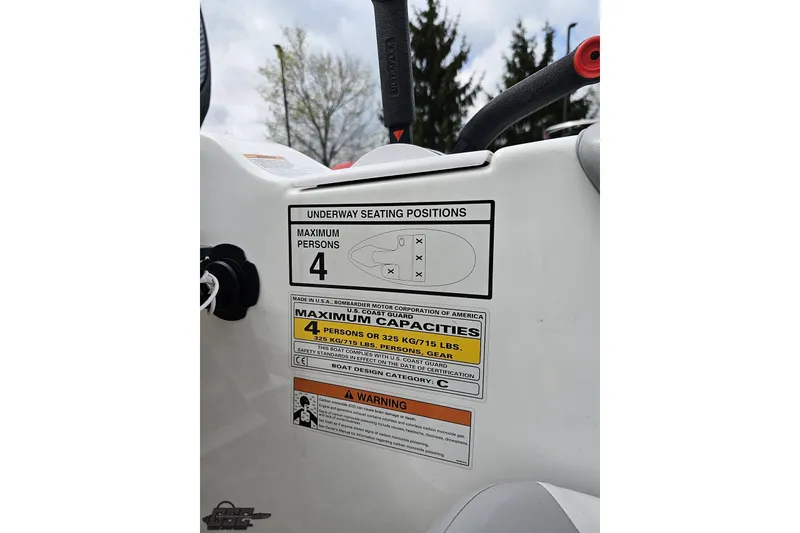 Slide: The Image of 2007 Sea-Doo 150 Speedster seating capacity label, maximum four persons, safety warnings visible. - 61