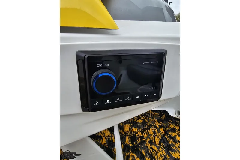 Slide: The Image of Clarion audio system on 2007 Sea-Doo 150 Speedster boat, featuring Bluetooth connectivity. - 62