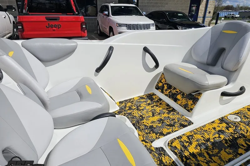 Slide: The Image of 2007 Sea-Doo 150 Speedster interior with gray seats and vibrant yellow-black flooring. - 63