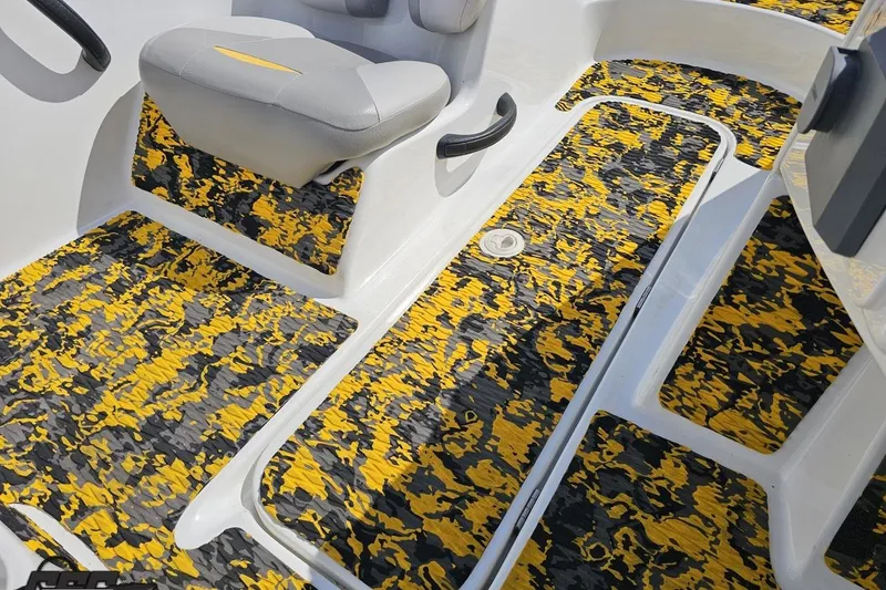 Slide: The Image of 2007 Sea-Doo 150 Speedster interior with vibrant yellow and black patterned flooring. - 64