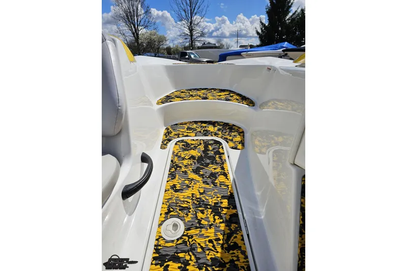 Slide: The Image of 2007 Sea-Doo 150 Speedster interior with vibrant yellow and black flooring design. - 66