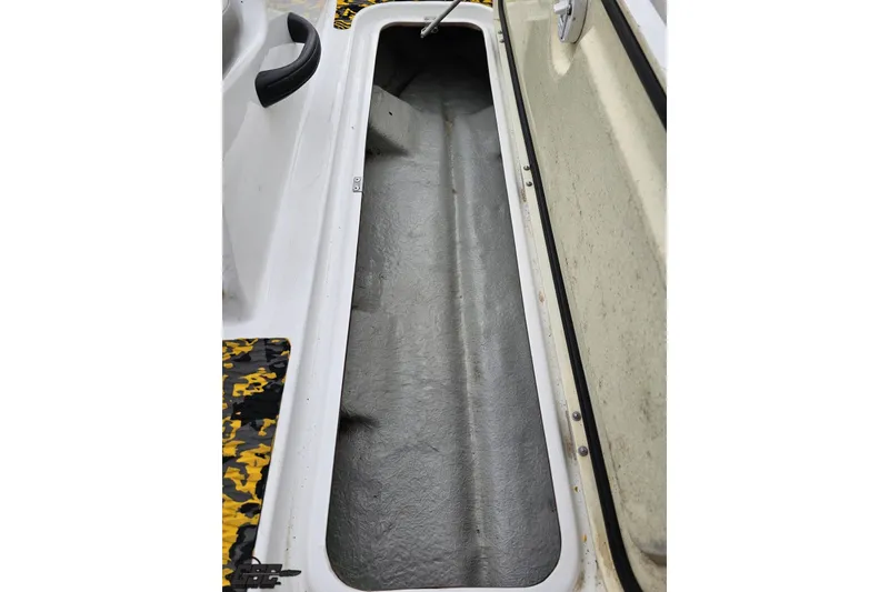 Slide: The Image of Open storage compartment in 2007 Sea-Doo 150 Speedster boat, showcasing interior space. - 68