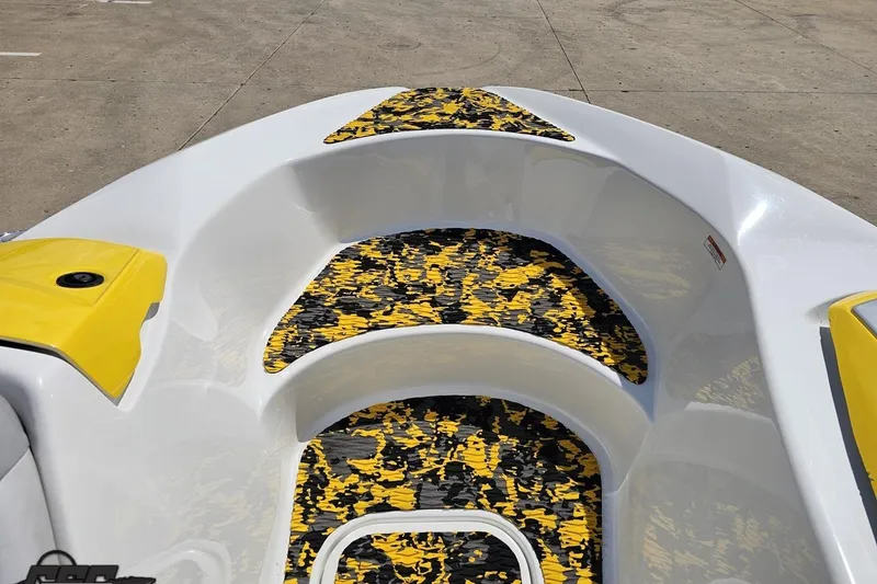 Slide: The Image of 2007 Sea-Doo 150 Speedster boat interior with yellow and black patterned flooring. - 69