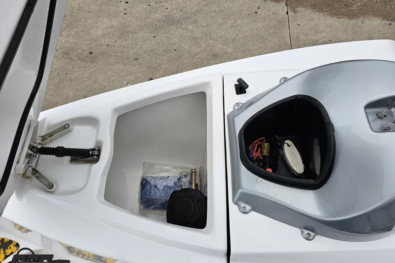 Slide: The Image of 2007 Sea-Doo 150 Speedster storage compartments with various items inside. - 71