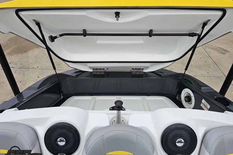 Slide: The Image of 2007 Sea-Doo 150 Speedster boat interior with open storage compartment and speakers. - 83