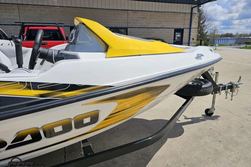 Slide: The Image of 2007 Sea-Doo 150 Speedster boat with yellow accents on a trailer. - 9