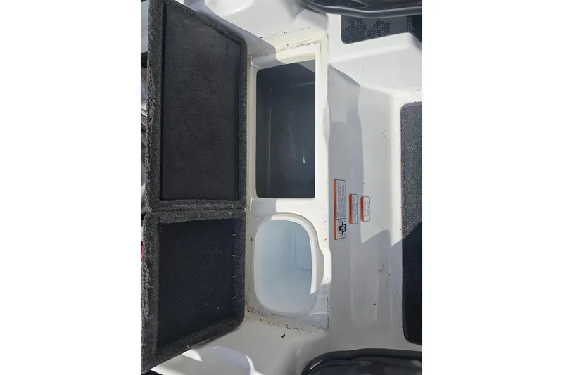 Slide: The Image of 2015 Nitro Z-7 boat storage compartments with open lids, showcasing interior space. - 11