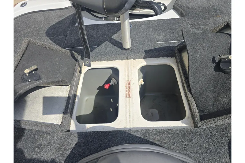 Slide: The Image of Open storage compartments on a 2015 Nitro Z-7 boat deck. - 12