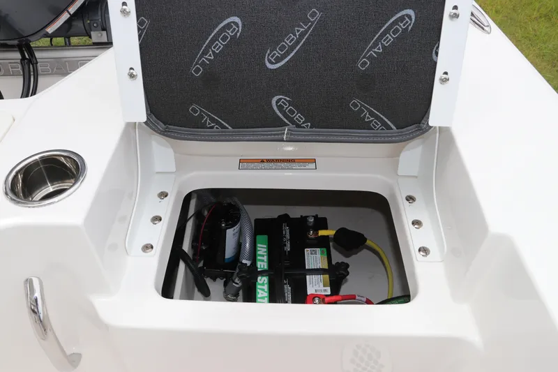 Slide: The Image of Battery compartment of 2026 Robalo 206 Cayman boat with branded seat cover. - 15