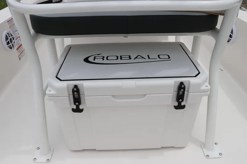 Slide: The Image of 2026 Robalo 206 Cayman boat cooler with secure latches and branded lid. - 16