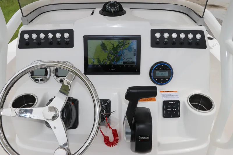 Slide: The Image of 2026 Robalo 206 Cayman boat dashboard with Garmin navigation and Yamaha controls. - 17
