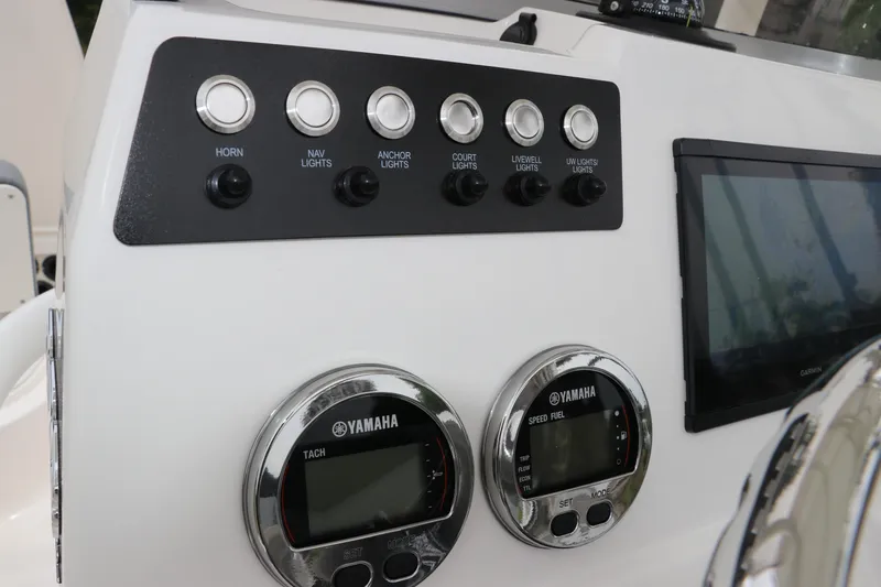 Slide: The Image of Control panel of 2026 Robalo 206 Cayman boat with Yamaha gauges and switches. - 18