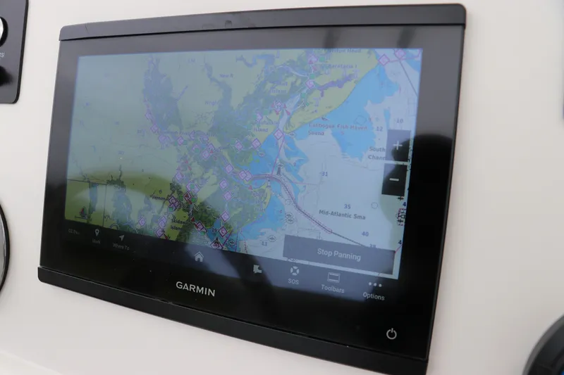 Slide: The Image of Garmin navigation display on 2026 Robalo 206 Cayman boat, showing detailed marine map. - 20