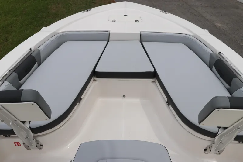Slide: The Image of 2026 Robalo 206 Cayman boat interior with cushioned seating and sleek design. - 26