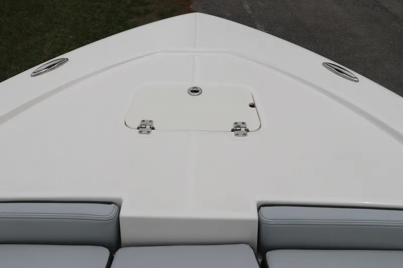 Slide: The Image of Bow of 2026 Robalo 206 Cayman boat with storage hatch and seating. - 29
