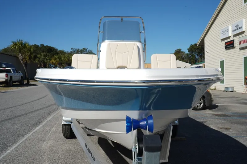 Slide: The Image of 2026 Robalo 206 Cayman boat on trailer, parked outdoors near buildings. - 4